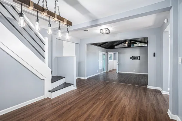 a view of entryway with wooden floor