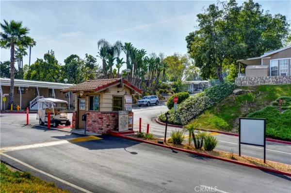 an outdoor view of the house and car parked