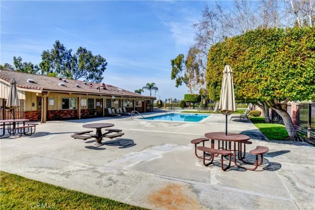 a view of a swimming pool and sitting area