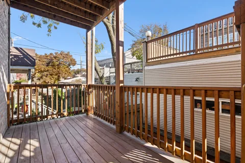 a view of balcony with wooden floor