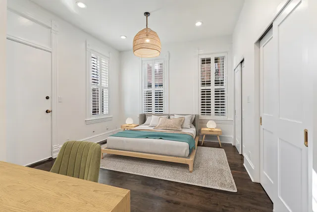 a bedroom with a bed and window