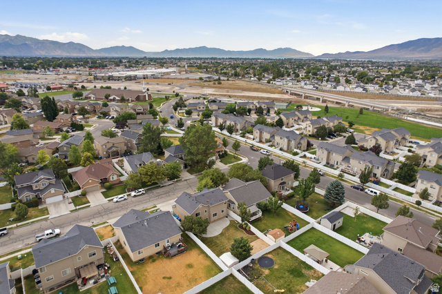 2223 North Pointe Meadow Loop Lehi, UT 84048 - Photo 52 of 56 Aerial perspective showcasing a residential neighborhood with distant mountain ranges