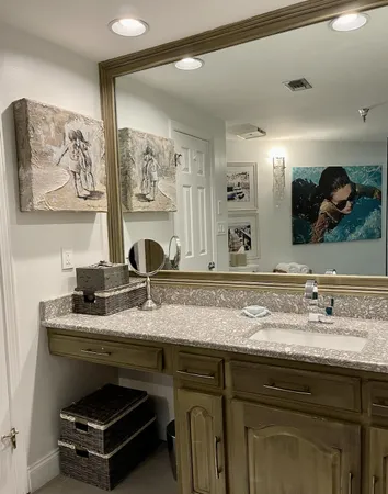 a bathroom with a sink and a mirror