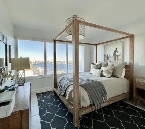 a bedroom with a bed and glass window