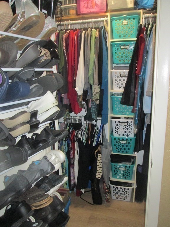176 Swanson Road, Unit 305 Boxborough, MA 01719 - Photo 11 of 14 a view of walk in closet with clothes and shoes