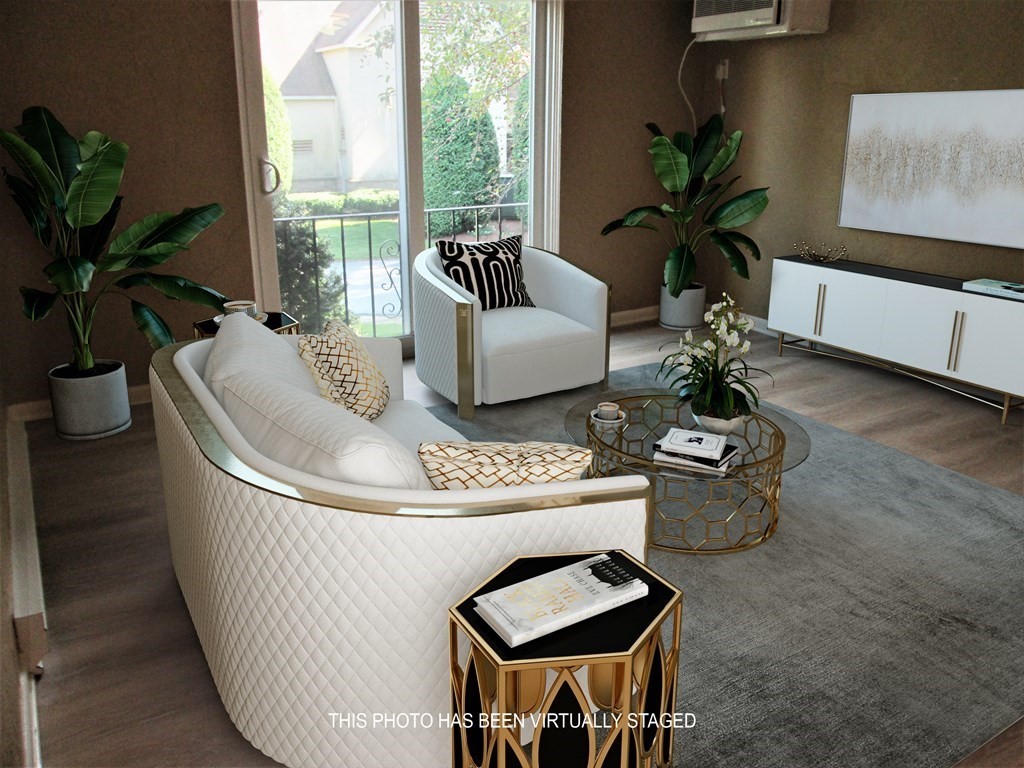 176 Swanson Road, Unit 305 Boxborough, MA 01719 - Photo 3 of 14 a living room with furniture and a potted plant