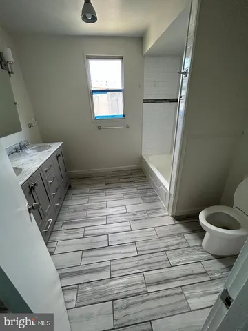 a bathroom with a sink and toilet