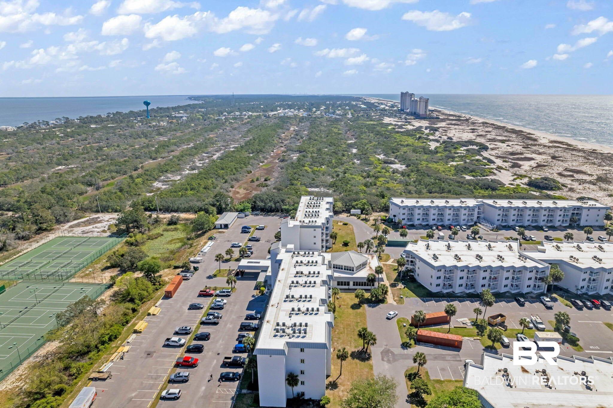 400 Plantation Road, Unit 4501 Gulf Shores, AL 36542 - Photo 17 of 30 Aerial perspective showcasing multiple residential buildings with surrounding natural and developed elements