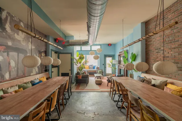 a dining room with furniture and window