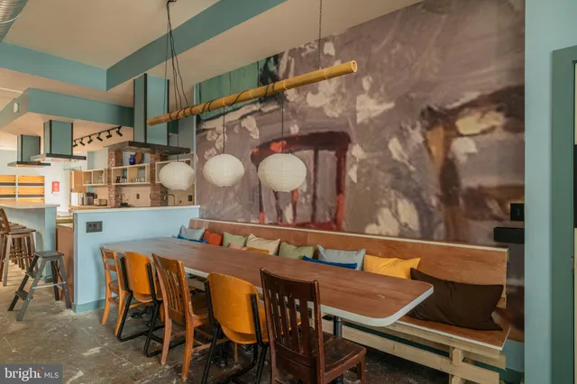 a dining room with furniture and window