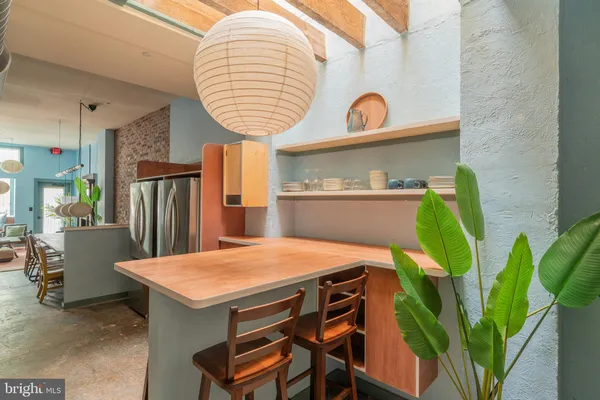 a room that has a table and chairs in it