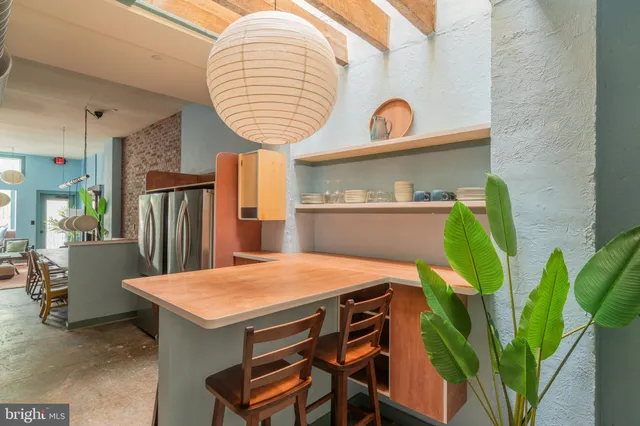 a room that has a table and chairs in it