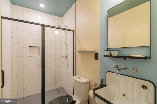 a bathroom with a toilet and a sink