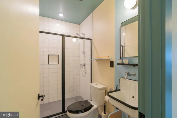a bathroom with a tub and shower