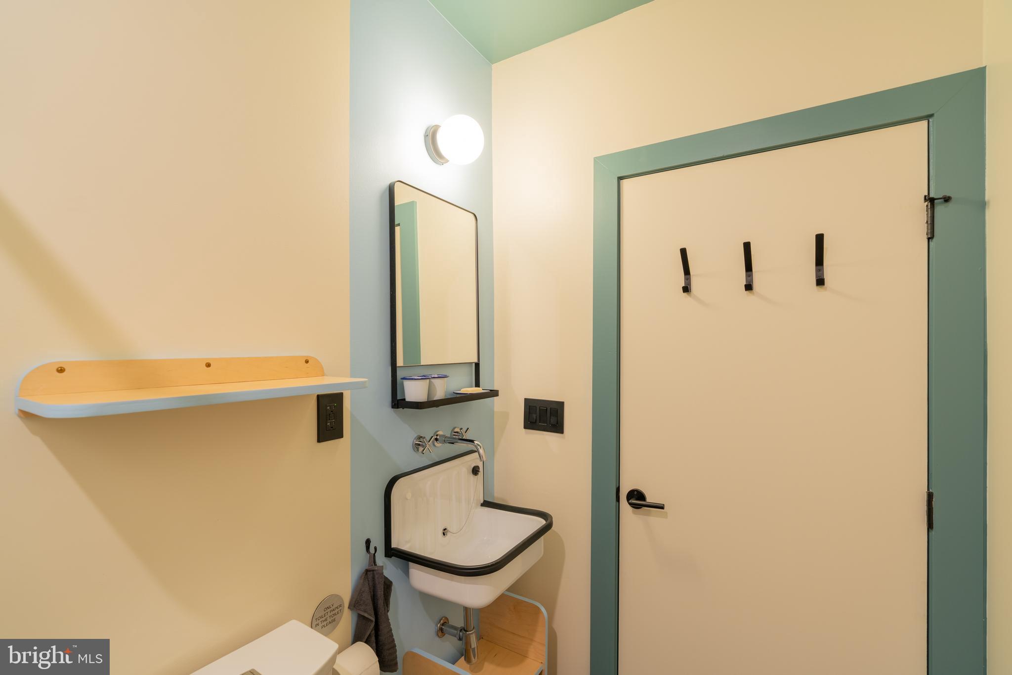 711 G Street Southeast Washington, DC 20003 - Photo 36 of 55 a bathroom with a toilet and a sink