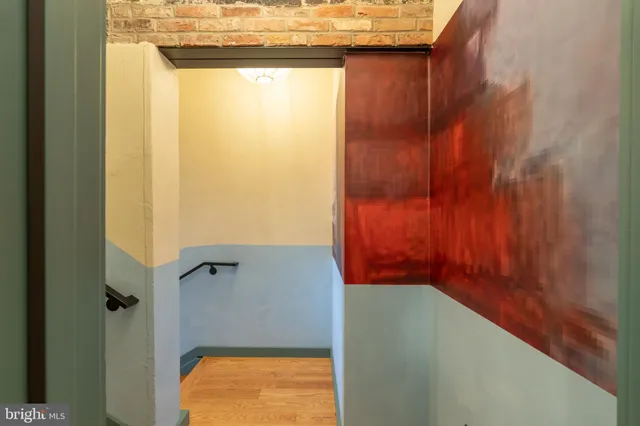 a backyard of a house with a table and chairs