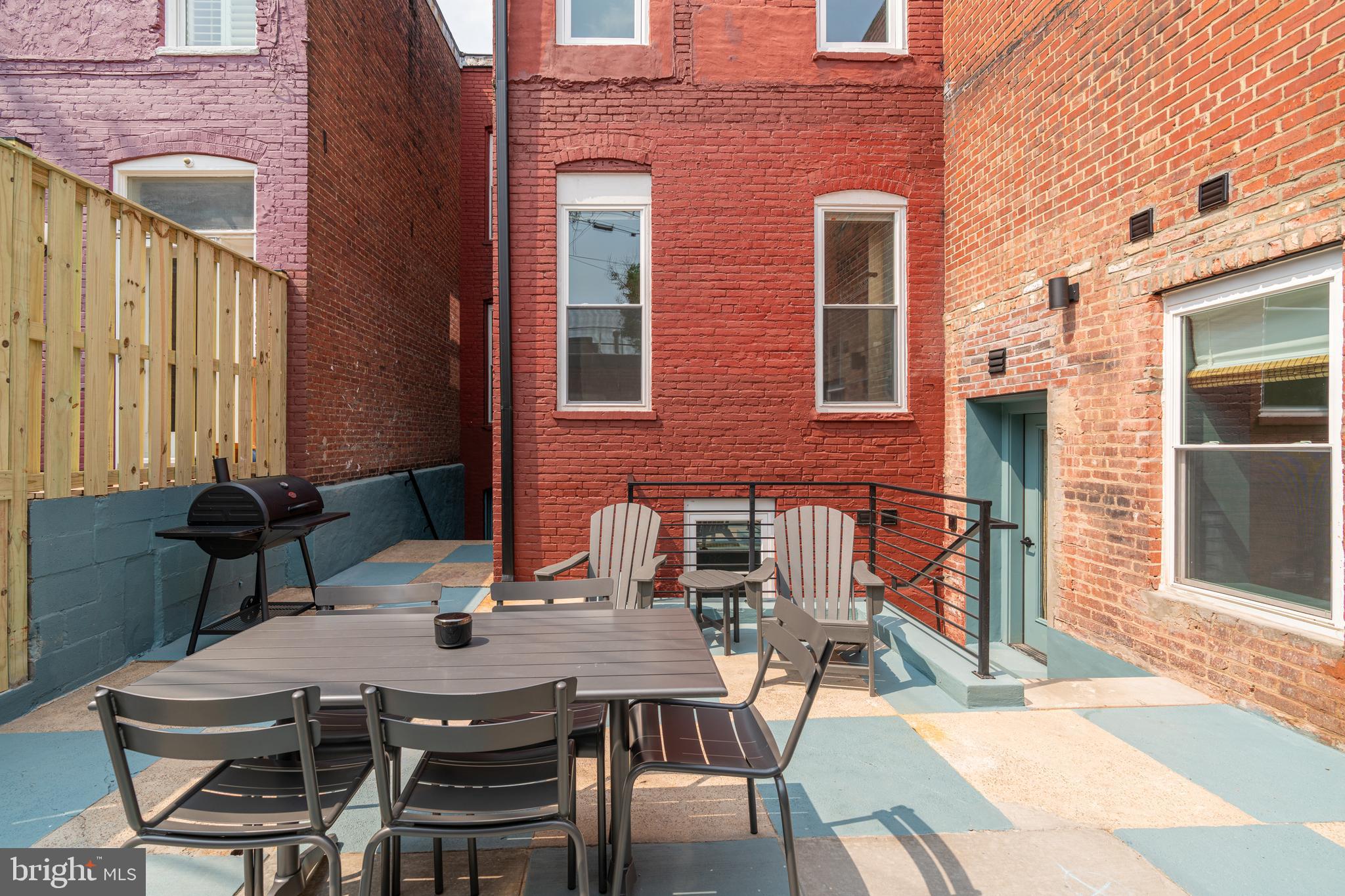 711 G Street Southeast Washington, DC 20003 - Photo 42 of 55 a view of a dinning table and chairs in the patio