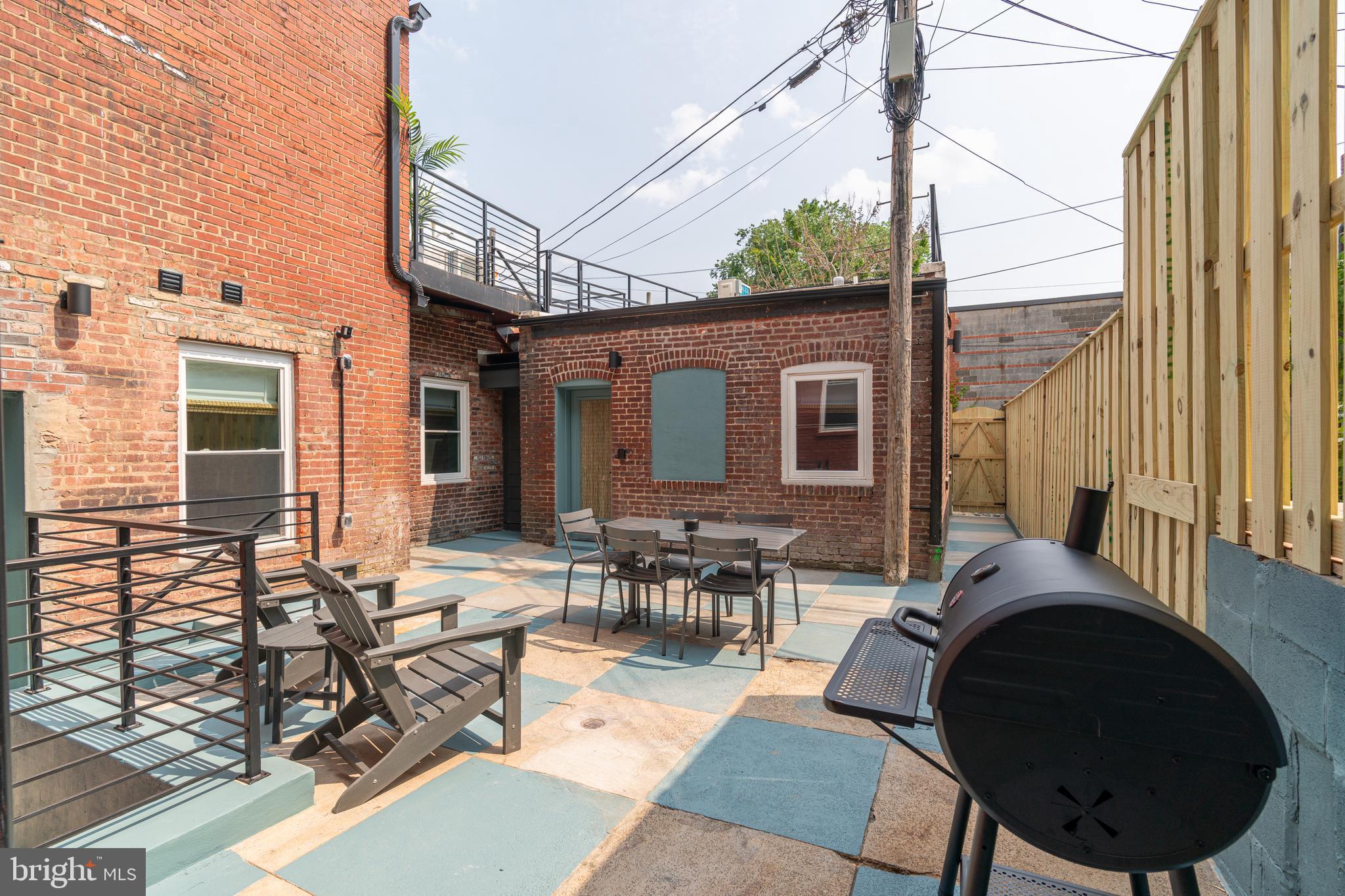 711 G Street Southeast Washington, DC 20003 - Photo 44 of 55 a backyard of a house with outdoor seating