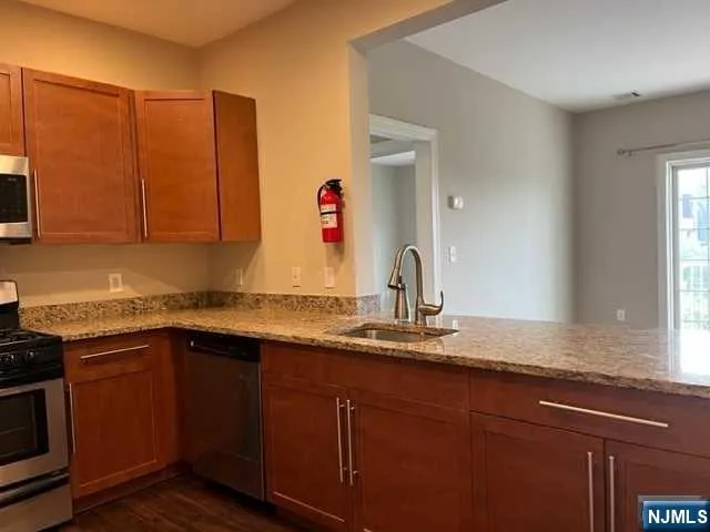 a kitchen with sink and cabinets