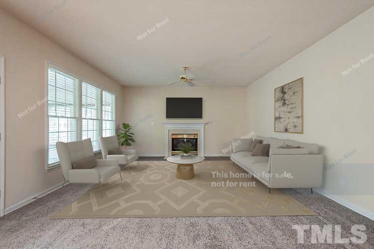 3300 Stone Castle Court Raleigh, NC 27613 - Photo 2 of 24 a living room with furniture and a flat screen tv