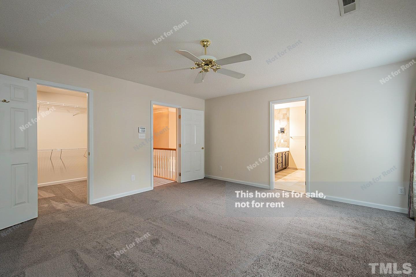 3300 Stone Castle Court Raleigh, NC 27613 - Photo 14 of 24 an empty room with windows and ceiling fan view