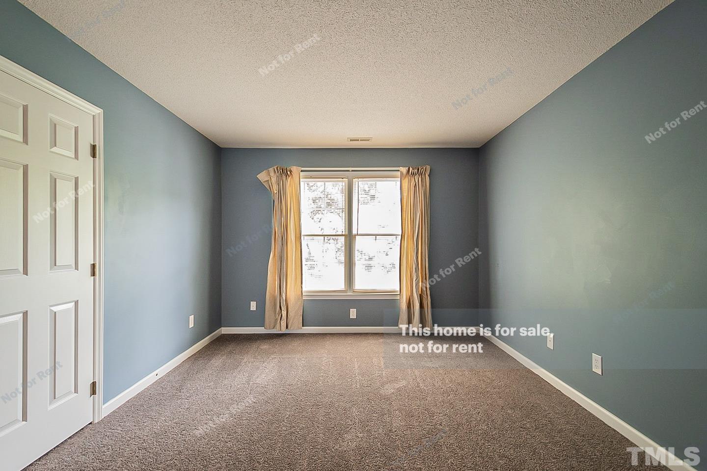 3300 Stone Castle Court Raleigh, NC 27613 - Photo 17 of 24 a view of an empty room with a window