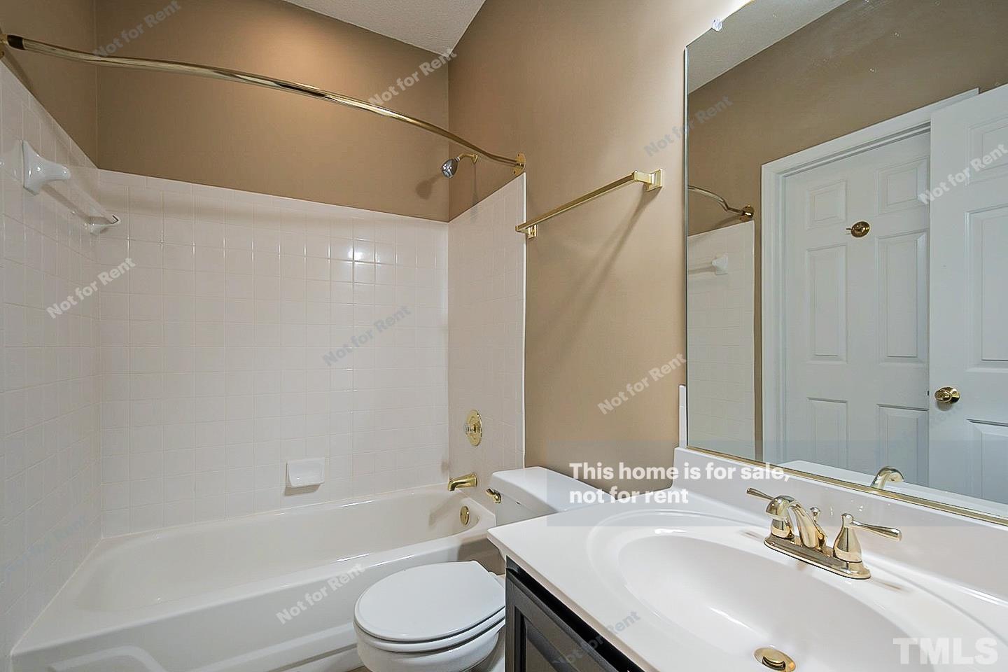 3300 Stone Castle Court Raleigh, NC 27613 - Photo 20 of 24 a bathroom with a sink a toilet and shower