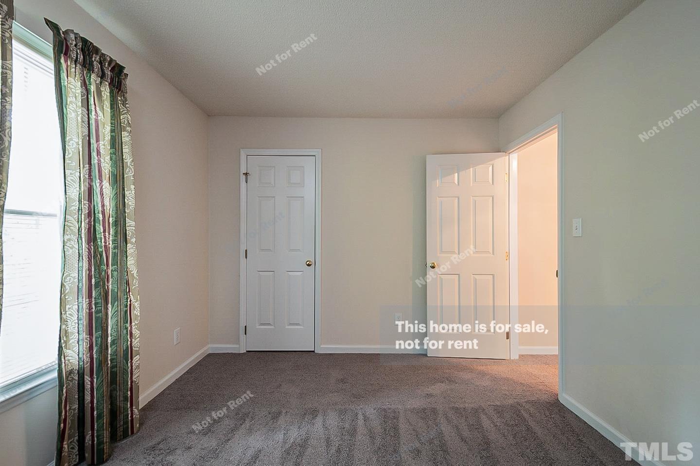 3300 Stone Castle Court Raleigh, NC 27613 - Photo 9 of 24 a view of empty room with wooden floor and fan
