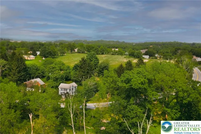 a backyard of a house with outdoor seating