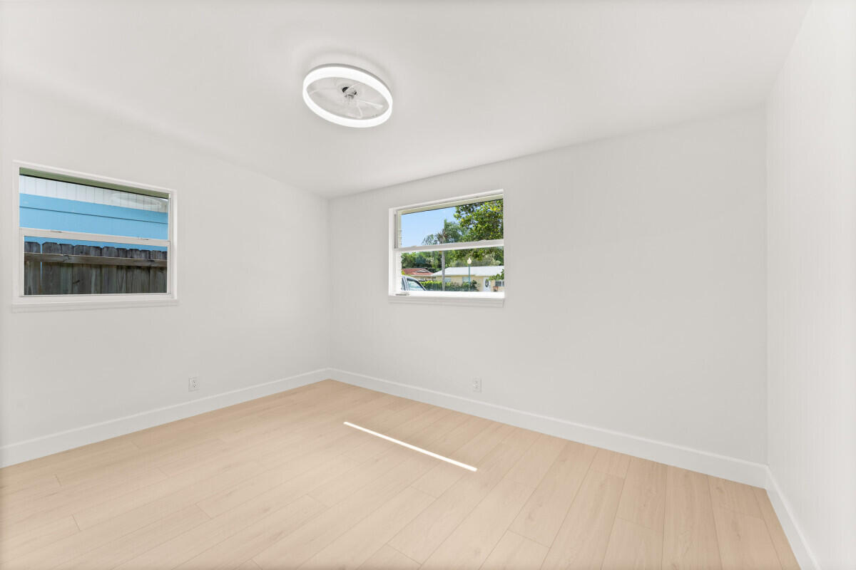 3797 Bahama Road Palm Beach Gardens, FL 33410 - Photo 26 of 27 an empty room with a window