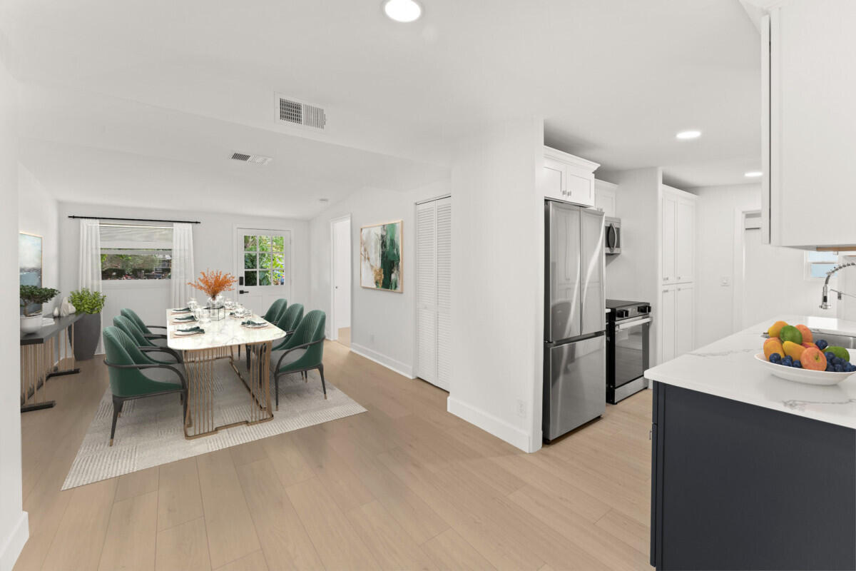 3797 Bahama Road Palm Beach Gardens, FL 33410 - Photo 4 of 27 a view of a kitchen and dining room