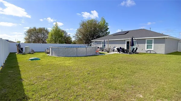 a aerial view of a house with swimming pool