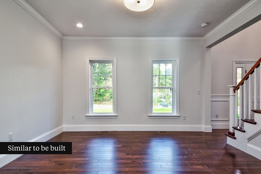 Lot 4 Arrow Path Natick, MA 01760 - Photo 11 of 18 a view of an empty room with wooden floor and a window