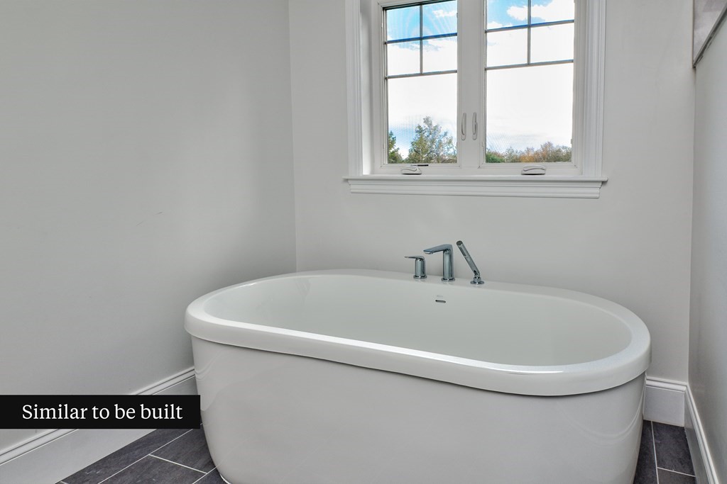 Lot 4 Arrow Path Natick, MA 01760 - Photo 17 of 18 a white bath tub sitting next to a window