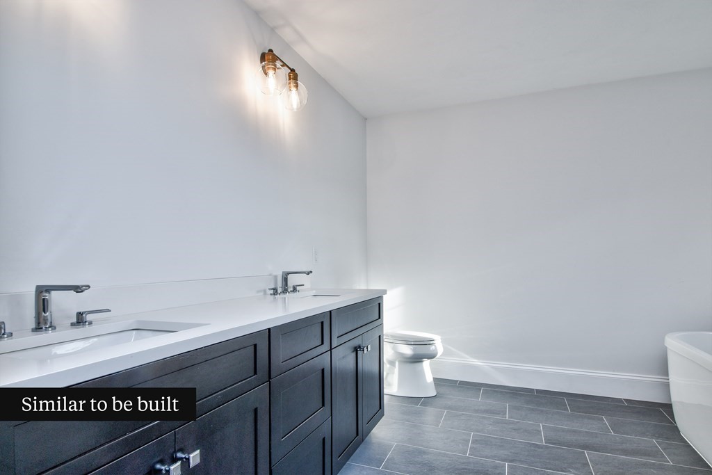 Lot 4 Arrow Path Natick, MA 01760 - Photo 18 of 18 a bathroom with a toilet a sink and mirror