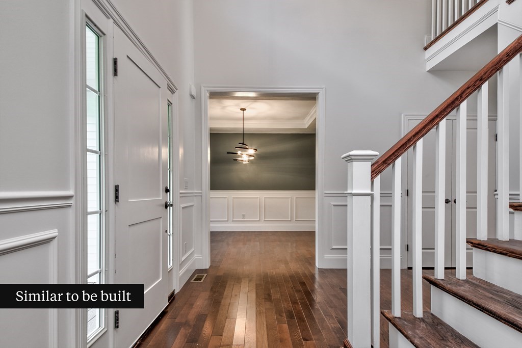 Lot 4 Arrow Path Natick, MA 01760 - Photo 3 of 18 a view of a hallway with wooden floor and staircase
