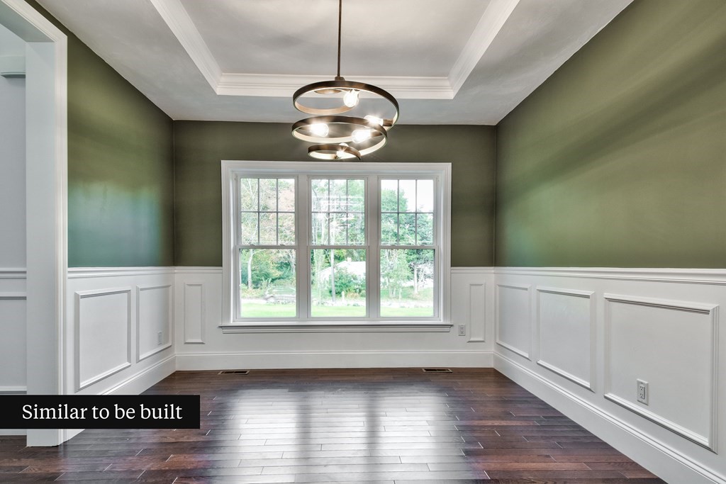 Lot 4 Arrow Path Natick, MA 01760 - Photo 4 of 18 a view of an empty room with wooden floor and a window