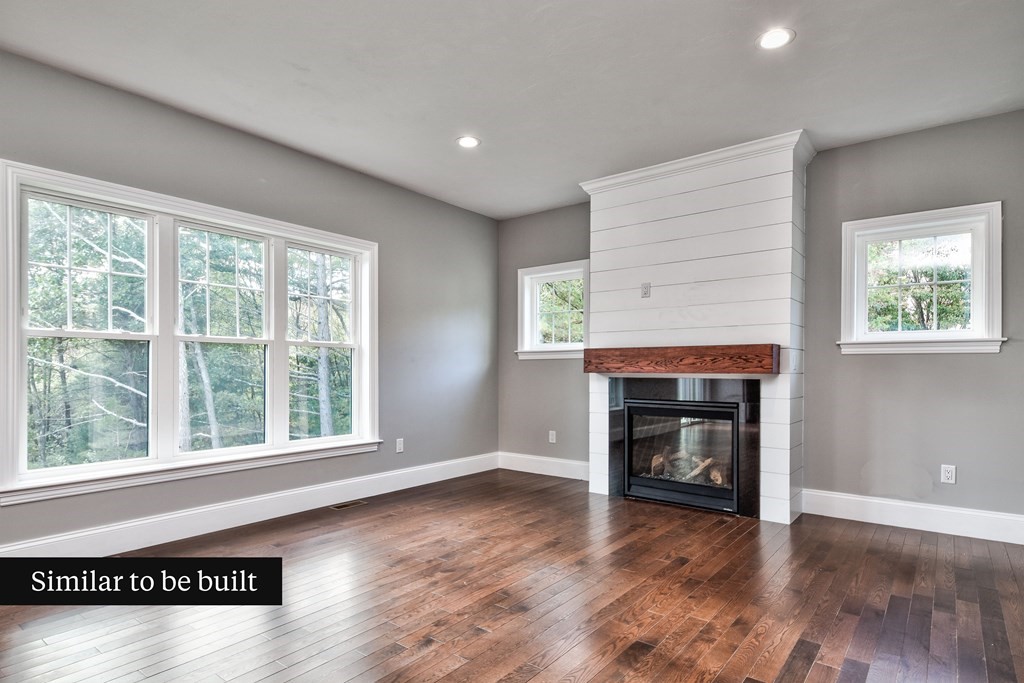 Lot 4 Arrow Path Natick, MA 01760 - Photo 6 of 18 an empty room with windows and fireplace