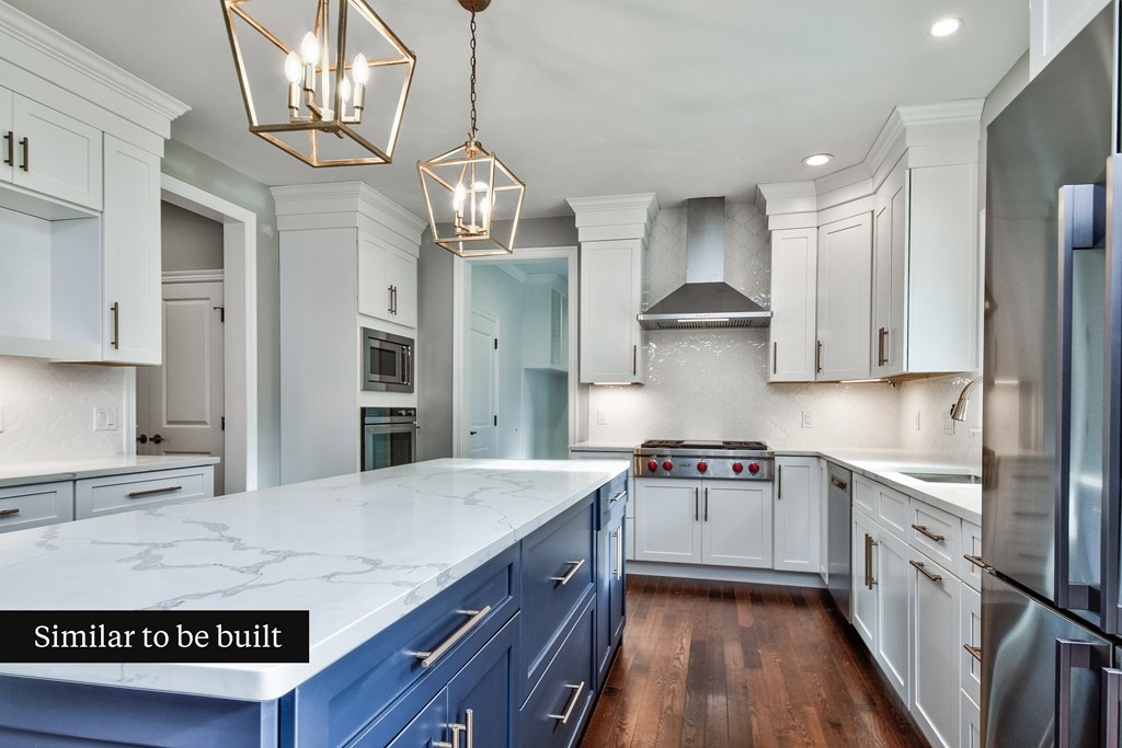 Lot 4 Arrow Path Natick, MA 01760 - Photo 8 of 18 a kitchen with kitchen island granite countertop a sink stove and refrigerator