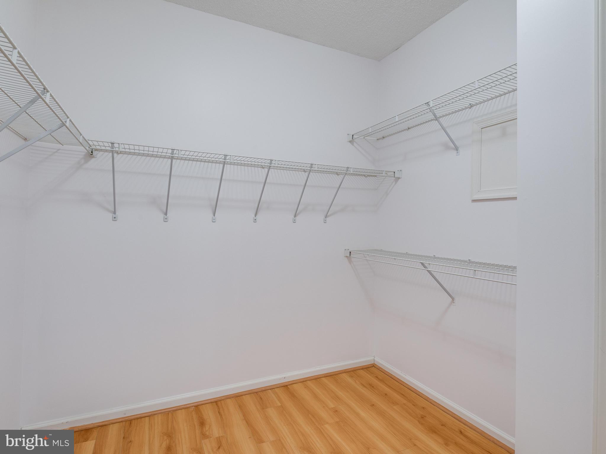 1701 Lake Shore Crest Drive, Unit 34 Reston, VA 20190 - Photo 11 of 28 a view of a room with racks on the wall