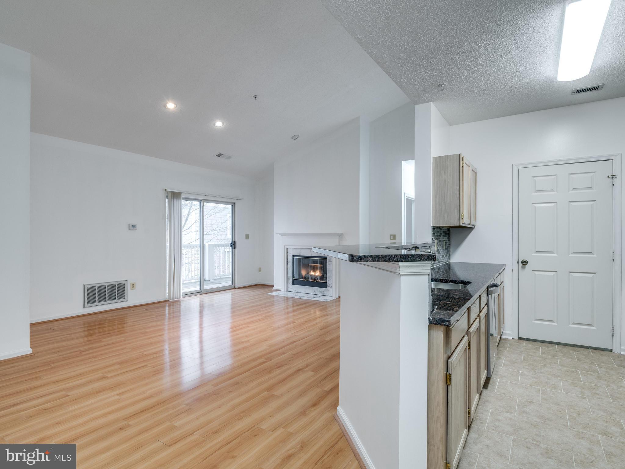 1701 Lake Shore Crest Drive, Unit 34 Reston, VA 20190 - Photo 12 of 28 a kitchen with a refrigerator and a stove top oven