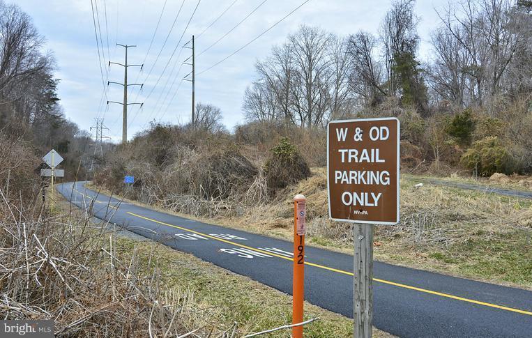 1701 Lake Shore Crest Drive, Unit 34 Reston, VA 20190 - Photo 21 of 28 a sign on the side of a road