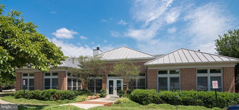 1701 Lake Shore Crest Drive, Unit 34 Reston, VA 20190 - Photo 23 of 28 a front view of a house with garden