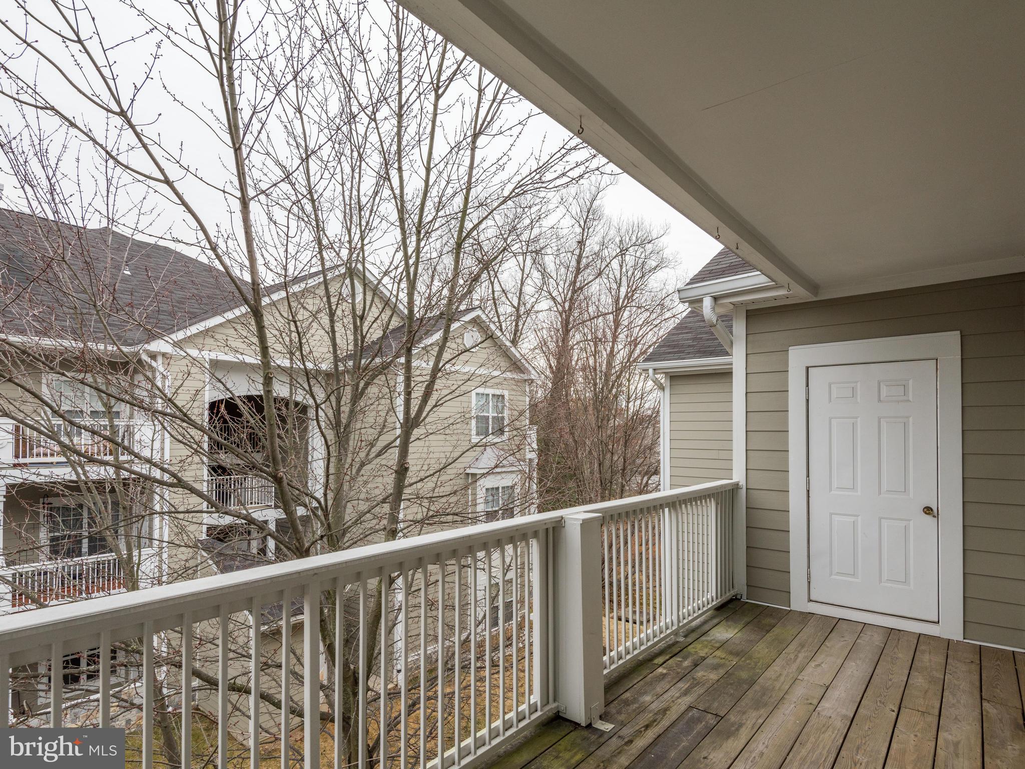 1701 Lake Shore Crest Drive, Unit 34 Reston, VA 20190 - Photo 26 of 28 a view of a wooden house with a large window