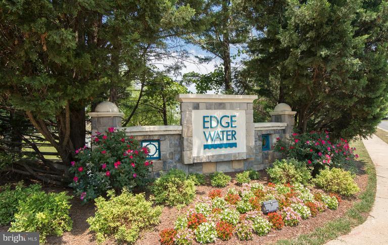 1701 Lake Shore Crest Drive, Unit 34 Reston, VA 20190 - Photo 28 of 28 front view of a house with a tree