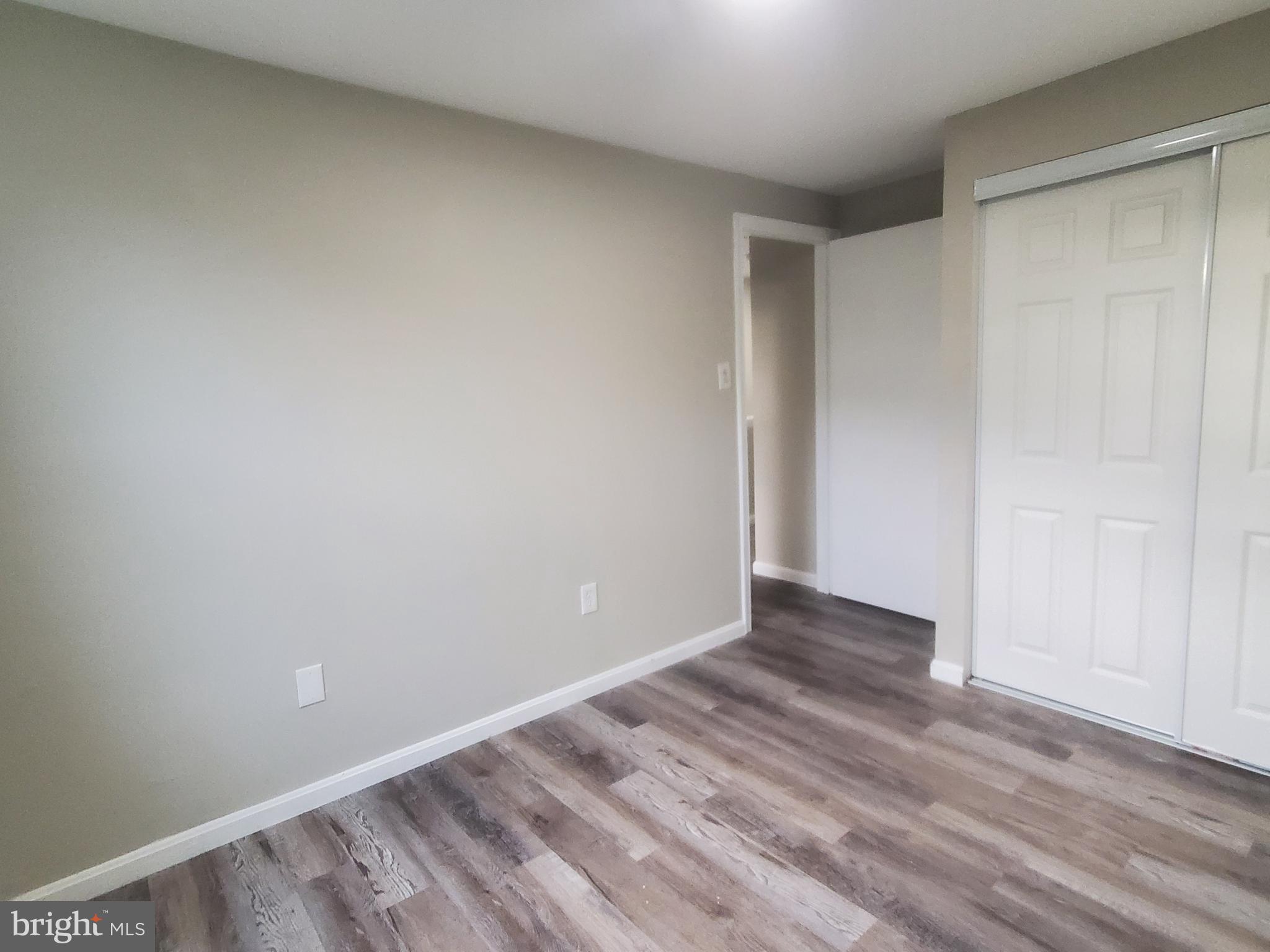 14813 Hammersmith Circle Silver Spring, MD 20906 - Photo 22 of 36 a view of an empty room with wooden floor