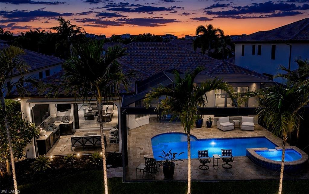 2220 Residence Circle Naples, FL 34105 - Photo 38 of 50 a view of house with outdoor seating and city view