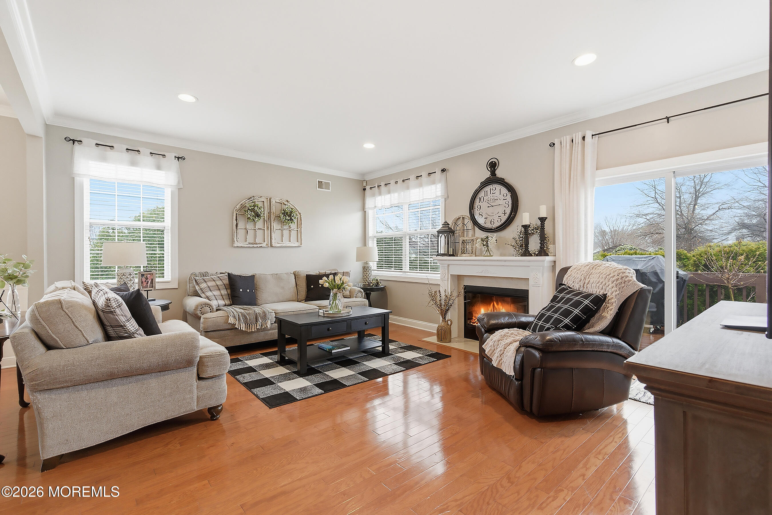 23 Little Leaf Lane Howell, NJ 07731 - Photo 15 of 37 a living room with furniture floor to ceiling window and a fireplace