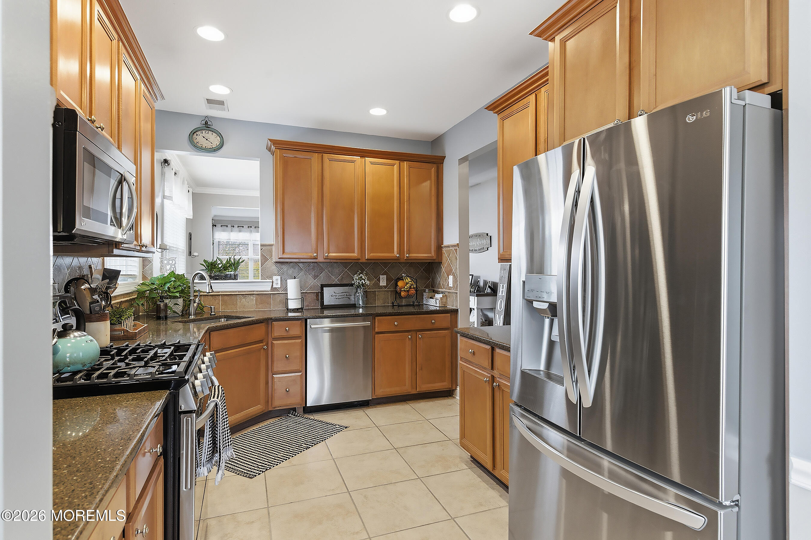23 Little Leaf Lane Howell, NJ 07731 - Photo 9 of 37 a kitchen with stainless steel appliances granite countertop a refrigerator a stove and a sink
