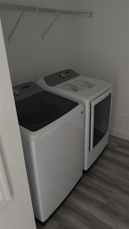 17490 Southwest 27th Circle Ocala, FL 34473 - Photo 12 of 12 a utility room with wooden floor washer and dryer